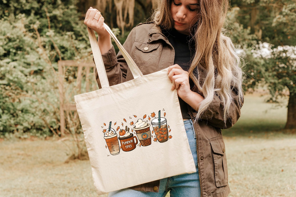 A sturdy canvas tote bag in natural color, featuring long handles and eco-friendly design