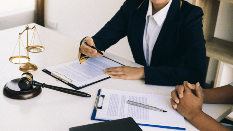 Lawyers representing a business client in a courtroom setting