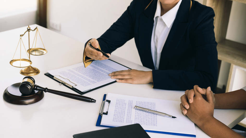 Lawyers representing a business client in a courtroom setting