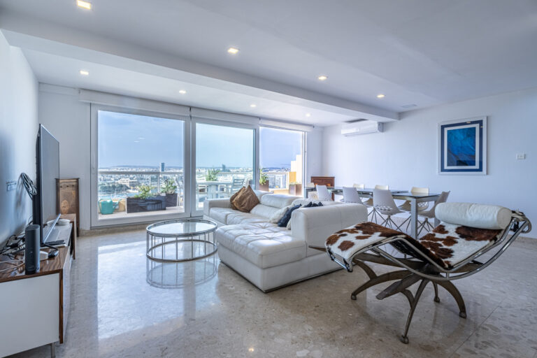 Modern luxury apartment interior in Sliema, Malta, with contemporary furnishings and sea views